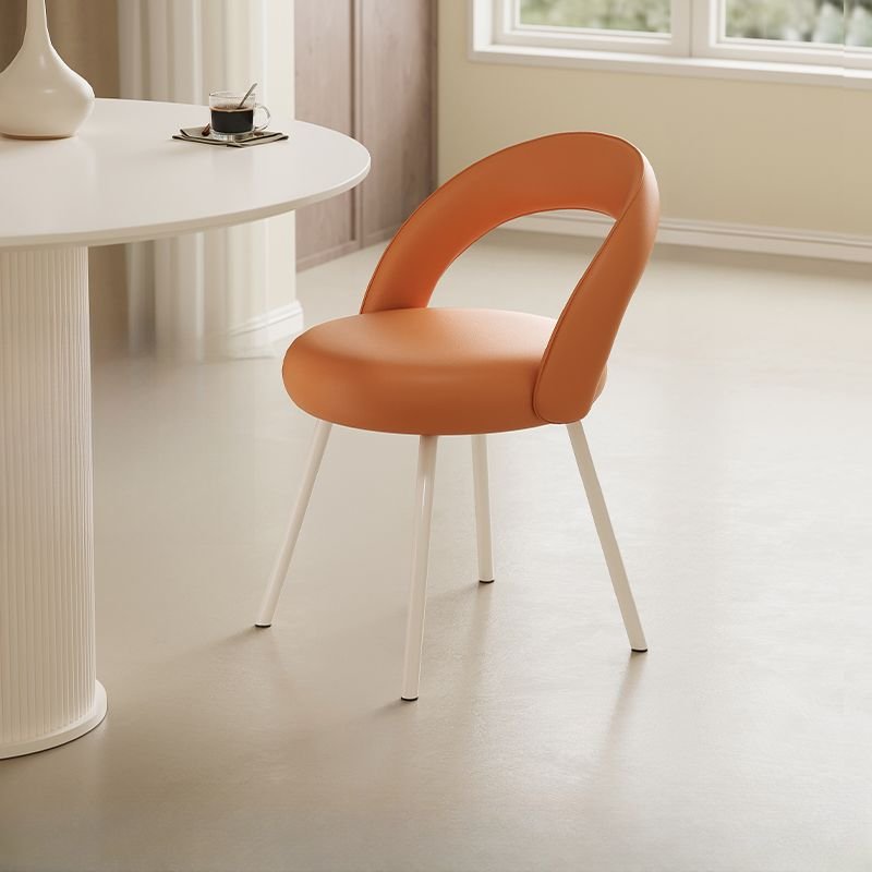 Dining Room Armless Chair with Foot Pads, Outlined Frame, and Sturdy Build, Orange, Faux Leather