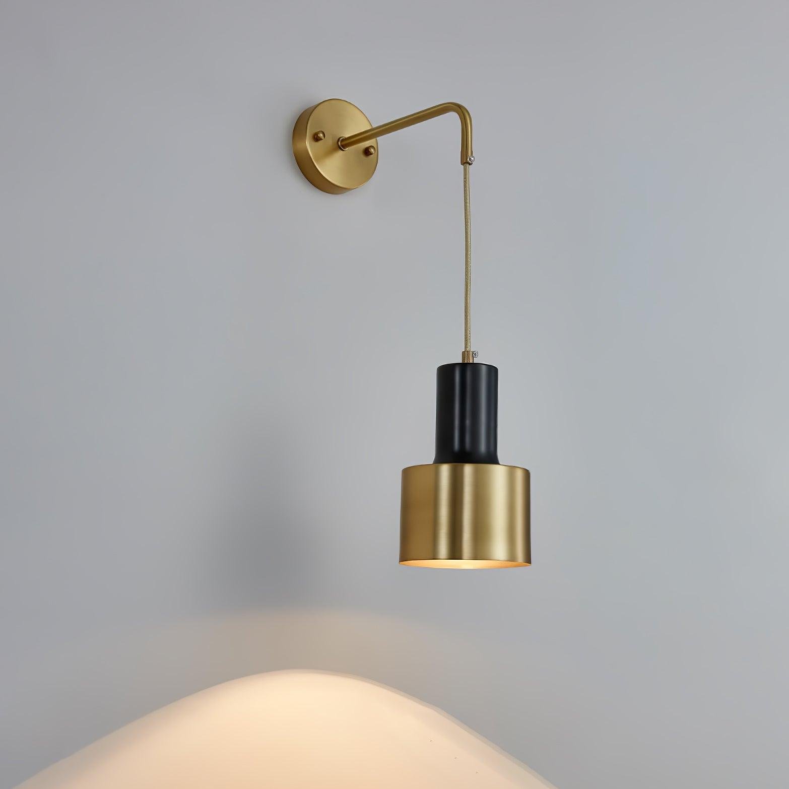 Arne Wall Light in gold and black, measuring 4.7" in diameter and 8.7" in height (12cm x 22cm).