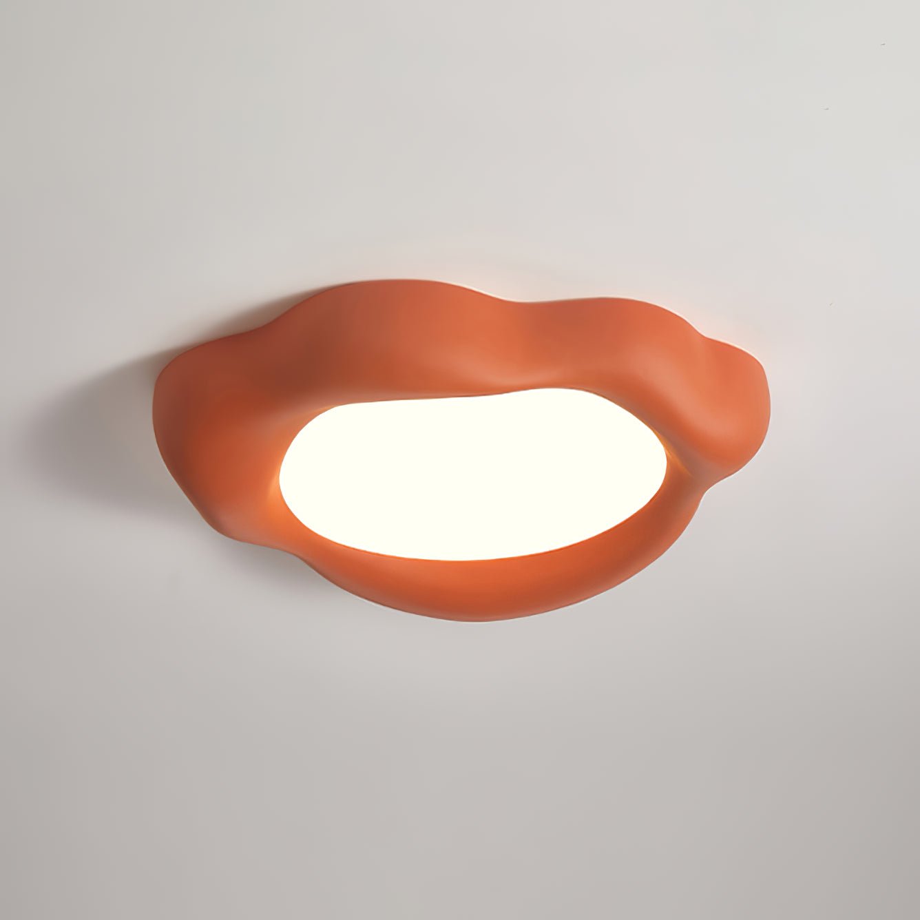 The Orange Kumo Ceiling Lamp offers a refreshing cool white light, measuring 21.6" in diameter and 3.9" in height (or 55cm x 10cm).